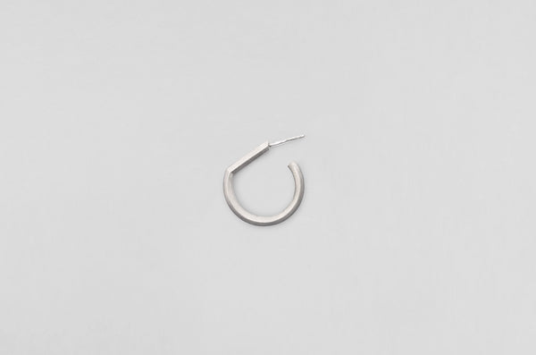 A handcrafted sterling silver earring from Arch collection by Makiami. Every piece is handcrafted by us, in our metalsmithing workshop in Stockholm, Sweden